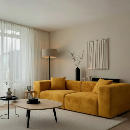 TOFU modular yellow sofa in a cozy home setting with a tripod floor lamp, wooden coffee table, and soft neutral interiors.