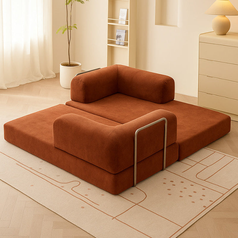 Relaxed lifestyle setting showing the SOFED sofa bed in tatami floor-seating mode for a minimalist aesthetic.