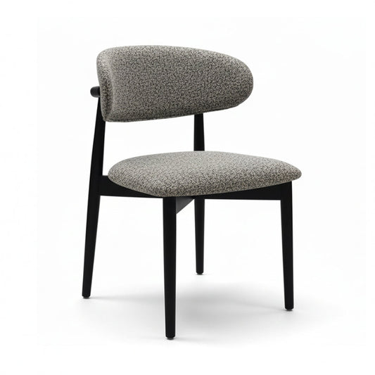 CROIST modern minimalist dining chair with round black wood back and textured grey fabric upholstery.