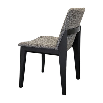 FOD modern dining chair back side view with solid black wood legs and grey fabric upholstery.
