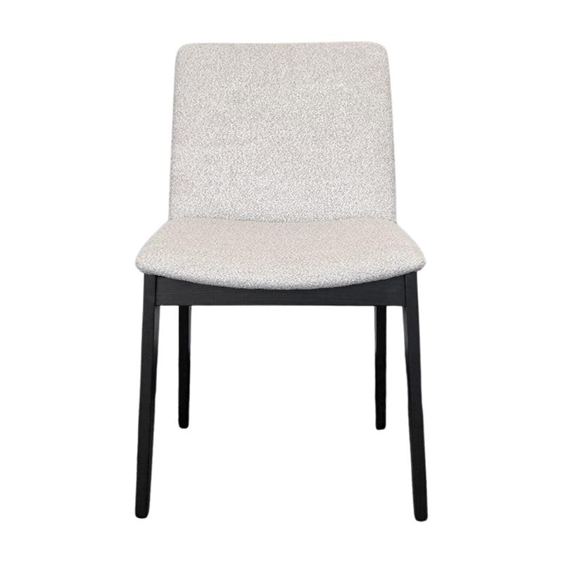 FOD modern dining chair front view with solid black wood legs and soft off-white fabric upholstery.