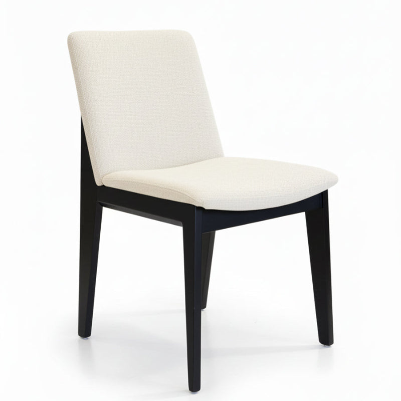 FOD modern dining chair side view with solid black wood legs and soft off-white fabric upholstery.