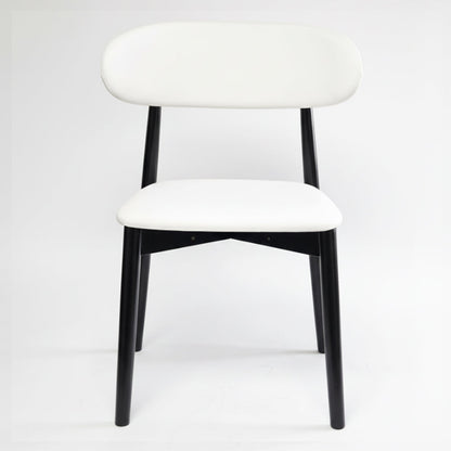 KROSNT modern minimalist dining chair with round black wood back and white faux leather seat on a clean white background,front view.