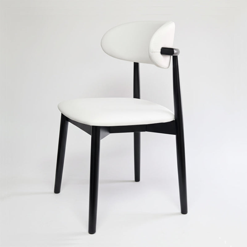 KROSNT modern minimalist dining chair with round black wood back and white faux leather seat on a clean white background.