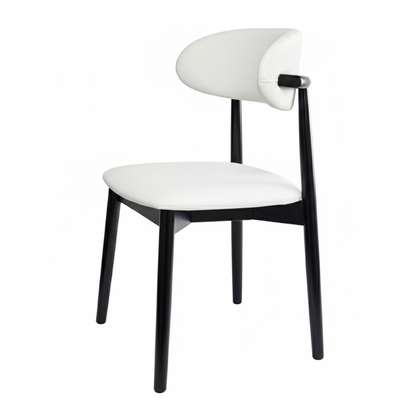 KROSNT sculptural chair side view, showing tapered black legs and curved white upholstered seat on the white background.