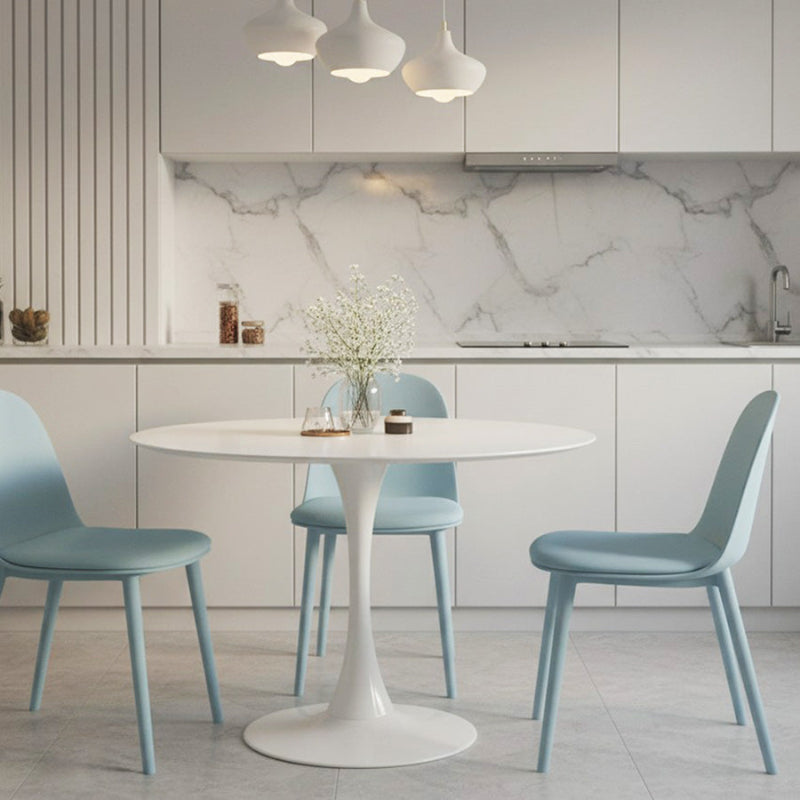 TLIP Round White Sintered Stone Dining Table with Blue MACARON Chairs – Modern Dining Room Scene, Bright and Stylish Décor