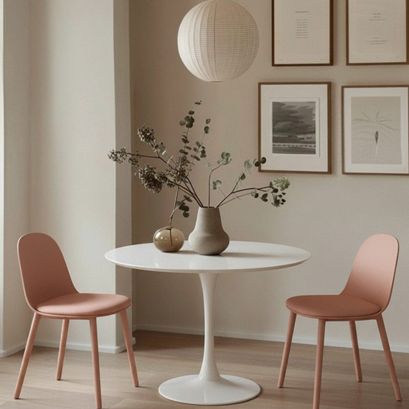 TLIP Round White Sintered Stone Dining Table with Two Pink MACARON Chairs – Chic Dining Room Setup with Soft Pastel Tones