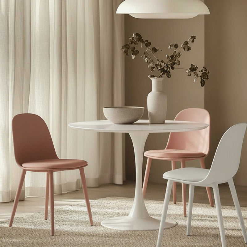 TLIP Round White Sintered Stone Dining Table with Colored MACARON Chairs – Chic Dining Room Setup with Soft Pastel Tones