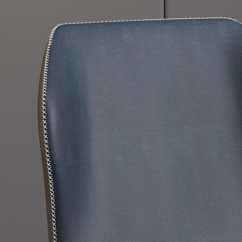 Close-up detail of the BF chair's dark blue faux leather backrest, highlighting the texture and the white decorative whipstitch contrast stitching.