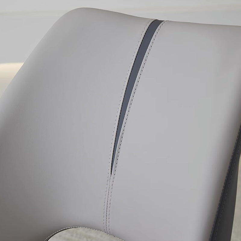 Close-up of MYRIN dining chair faux leather stitching and finish