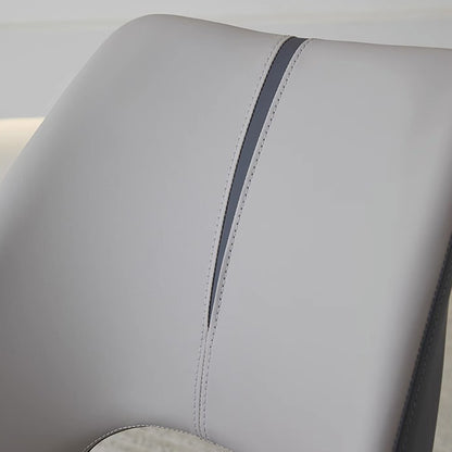 Close-up of MYRIN dining chair faux leather stitching and finish