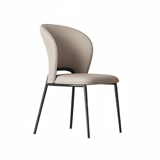 Front view of the GIMOTI dining chair in light beige faux leather, highlighting the curved wingback shape and slim black metal frame.
