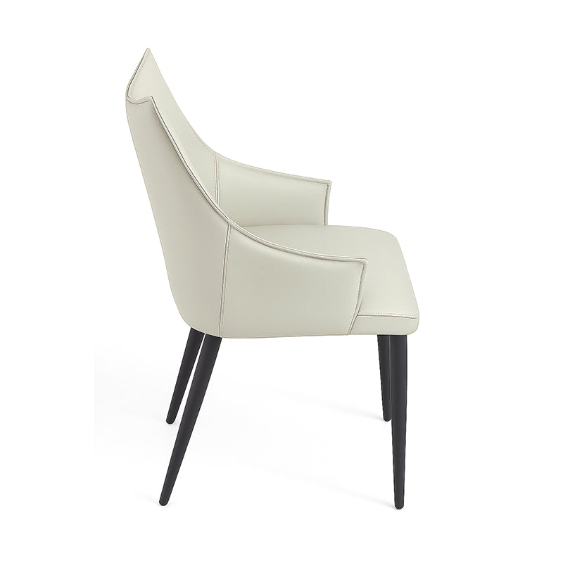 Side perspective view of SORREN Dining Chair in beige faux leather