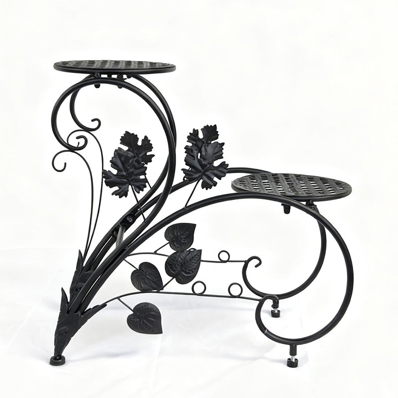 FLORON Black Wrought Iron Two-Tier Flower Stand, featuring intricate vine, leaf, and scrollwork design. Includes two circular mesh planter platforms, front view on a white background.