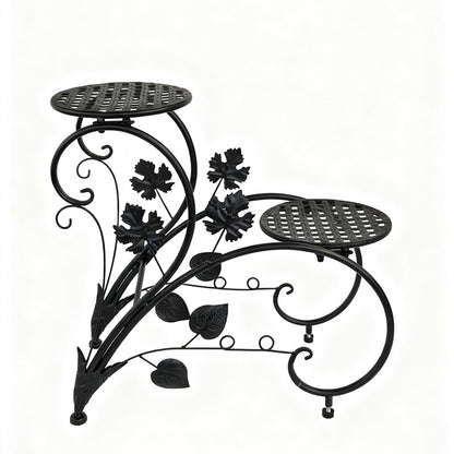 FLORON Black Wrought Iron Two-Tier Flower Stand, featuring intricate vine, leaf, and scrollwork design. Includes two circular mesh planter platforms, on a white background.