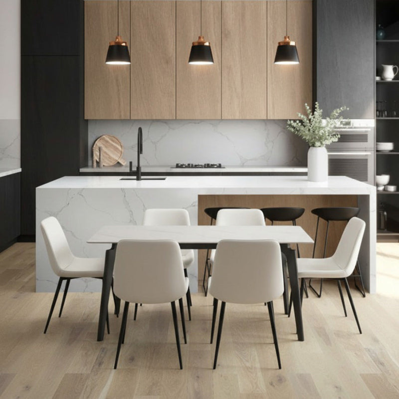 BESI Snow Mountain White Finish Sintered Stone Table with Gray Legs in the front of the Bar.