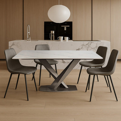 AXILON Snow White Sintered Stone Dining Table (Rectangle Top) scene. Positioned in front of a marble bar, with gray chairs.