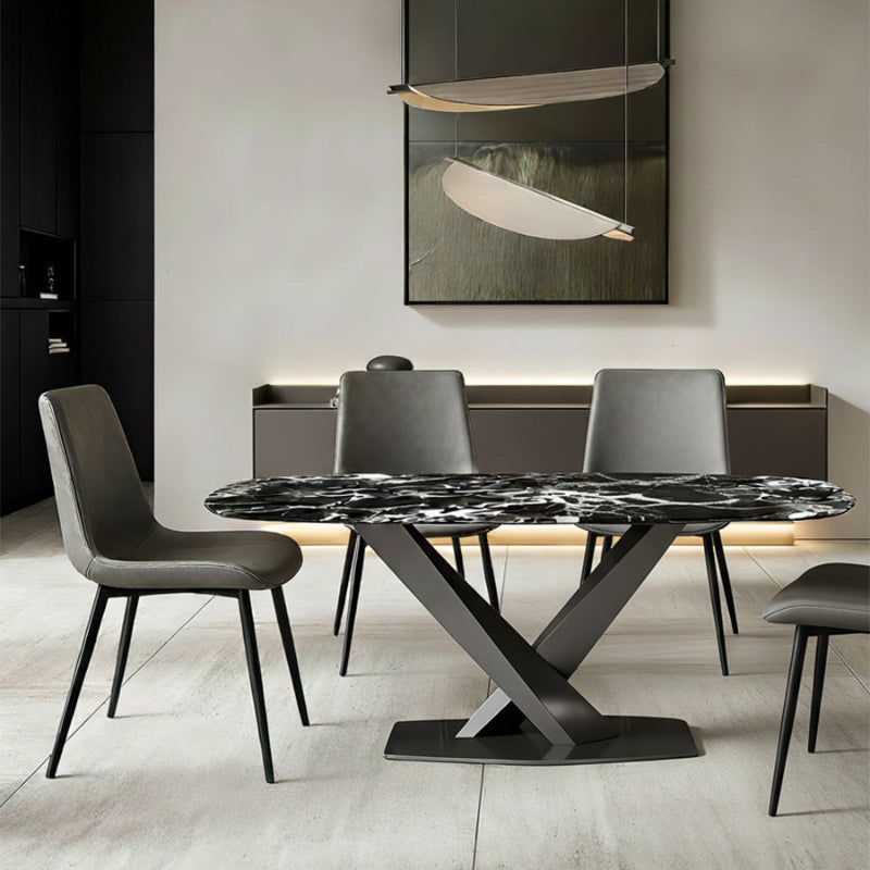 AXILON Bulgari Black Sintered Stone Dining Table scene, set under an elegant chandelier in a dining room. Featuring four gray SADE dining chairs.