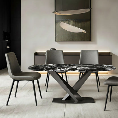 AXILON Bulgari Black Sintered Stone Dining Table scene, set under an elegant chandelier in a dining room. Featuring four gray SADE dining chairs.