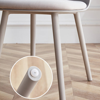 Detailed view of the MACARON chair's leg and foot pad, showing the sturdy LGF PP plastic construction and floor-protecting glide.
