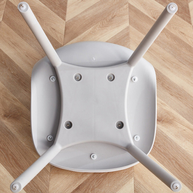 Underside view of the MACARON dining chair, showing the secure screw connections for the integrated LGF PP plastic legs and base structure.