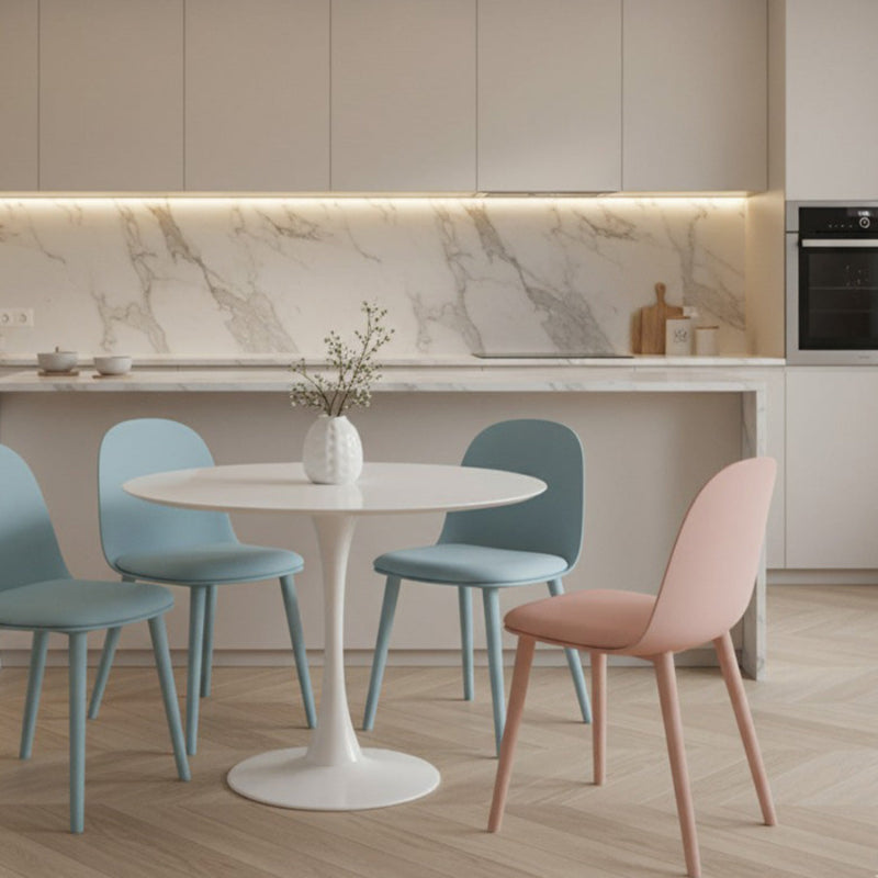 MACARON Nordic style dining chairs in light blue and pink, arranged around a round white table in a bright, modern kitchen setting.
