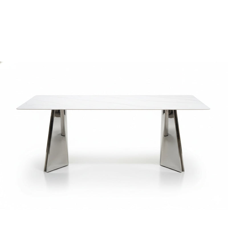 ARYLLIS marble-pattern sintered stone dining table with a mirror-finish stainless steel base, front perspective view on a clean background.