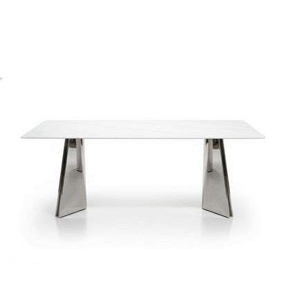 ARYLLIS marble-pattern sintered stone dining table with a mirror-finish stainless steel base, front perspective view on a clean background.