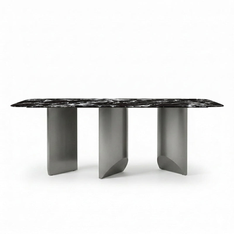 BVEL Sintered Stone dining table, front view perspective. Features a black marble-look top and sculptural gunmetal steel legs, ideal for a modern dining room.
