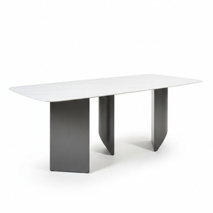 Angled view of the BVEL table, showing the 200cm/79in Sintered Stone top and the staggered, artistic steel base from an elevated perspective.