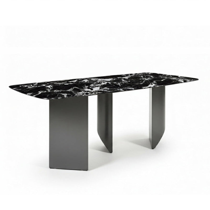 BVEL Sintered Stone dining table, angled view perspective. Features a black marble-look top and sculptural gunmetal grey steel legs, ideal for a modern dining room.