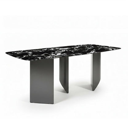 BVEL Sintered Stone dining table, angled view perspective. Features a black marble-look top and sculptural gunmetal grey steel legs, ideal for a modern dining room.