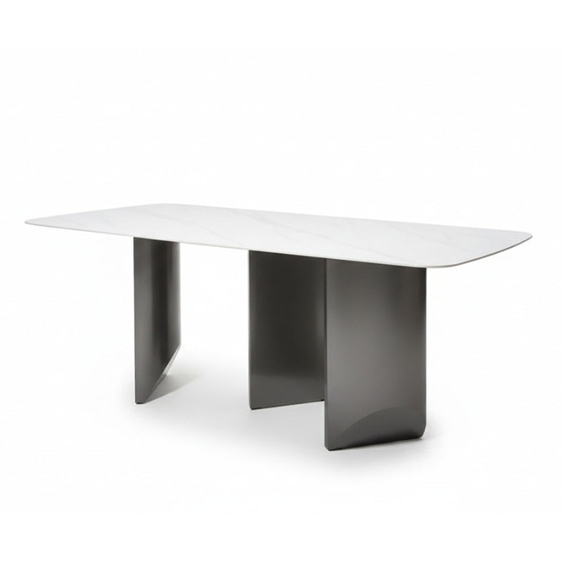 Angled view of the BVEL table, showing the 79in Sintered Stone top and the staggered, artistic steel base from an elevated perspective.