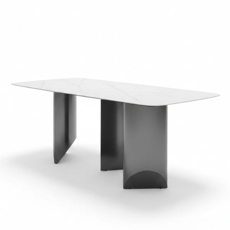 Angled view of the BVEL table, showing the 79in Sintered Stone top and the staggered, artistic steel base.