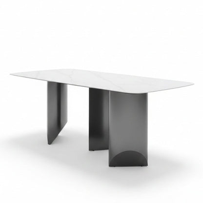Angled view of the BVEL table, showing the 79in Sintered Stone top and the staggered, artistic steel base.