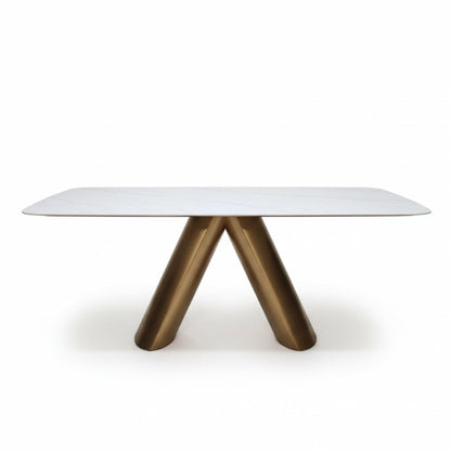 CYROLIN modern sintered stone dining table with a bronze-look steel base, front perspective view on a white background.