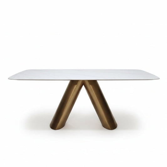 CYROLIN modern sintered stone dining table with a bronze-look steel base, front perspective view on a white background.