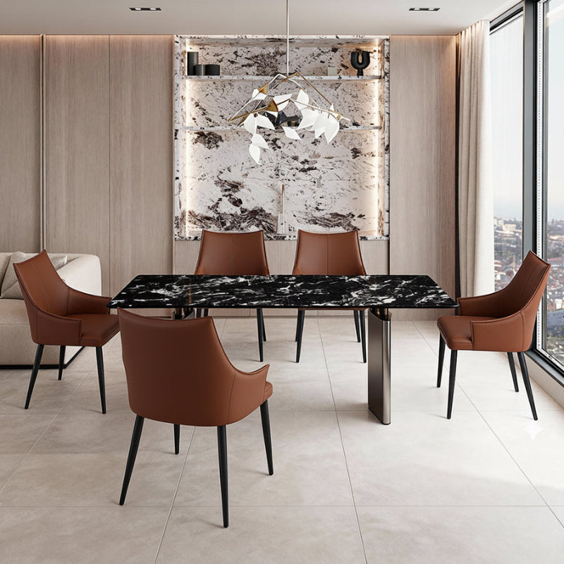 Dining room scene: The DIMON table with black marble-look top and stylish chairs, illuminated by a contemporary pendant light fixture, emphasizing the luxury and elegance of the space.