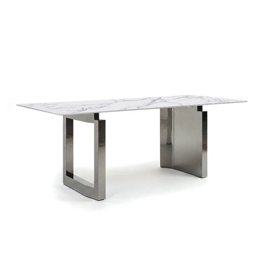 45-degree angle view of the HUXI dining table with a sintered stone top and mirror-finish steel base.