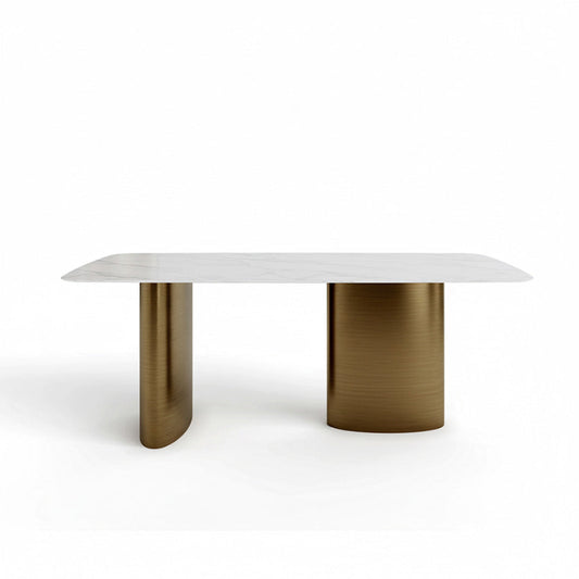 Front view of the 180cm/71in MIVANO dining table featuring a Snow Mountain White Sintered Stone top with grey veining, supported by an Antique Bronze stainless steel pedestal base against a plain white background.