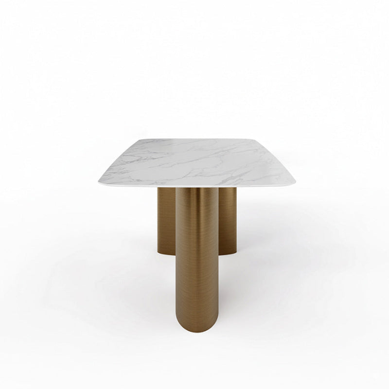 Side profile view of the MIVANO table, highlighting the sturdy, curved architectural design and brushed finish of the Antique Bronze stainless steel legs.