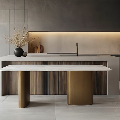 Modern open-concept kitchen scene featuring the standalone MIVANO Sintered Stone dining table positioned centrally in front of a large kitchen island and bar counter.