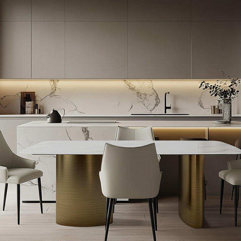 Lifestyle dining setting showing the 180cm/71in MIVANO table paired with upholstered dining chairs, creating a complete dining area in front of a modern kitchen bar.