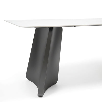 Close-up detail shot of the PETLS dining table's wide, angled gunmetal grey steel pedestal leg, highlighting its smooth finish and sturdy construction.