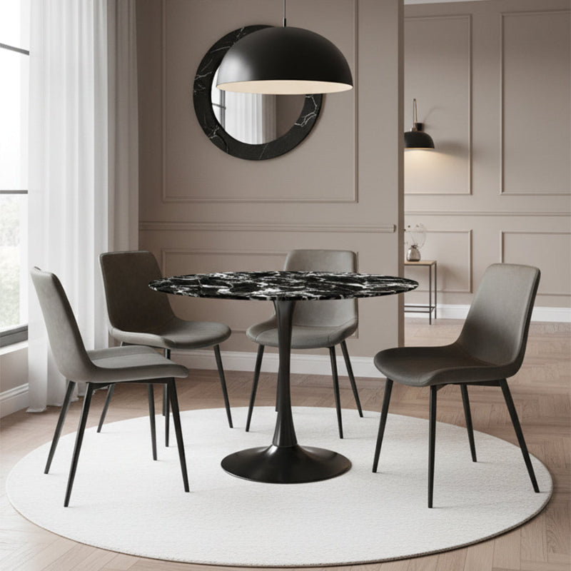 Elegant dining room scene featuring the TULIP 90CM Round Table with a Black Bulgari ceramic top and a matte grey base, paired with modern grey faux leather dining chairs.