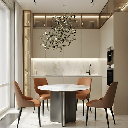 LUMARA 90cm (35.5in) round dining table with a snow mountain white marble sintered stone top placed in a modern kitchen interior setting.