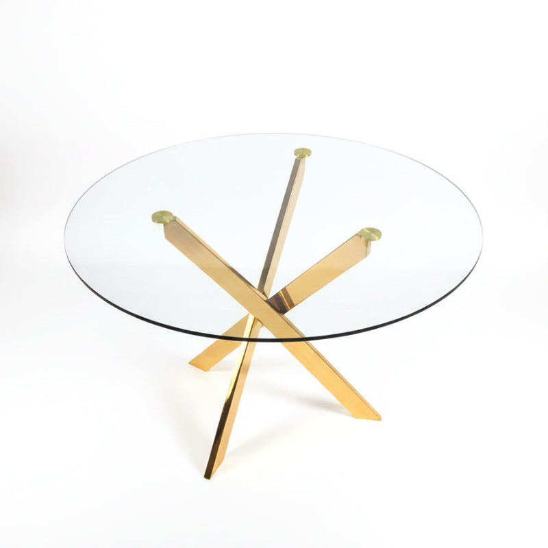 TRINITY round glass dining table featuring a 39-inch clear glass top and a gold mirror-finish stainless steel base, close-up detail view.