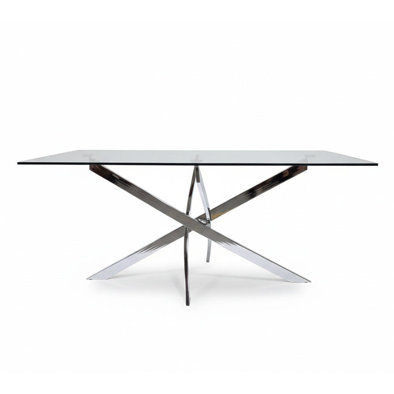 Front angled view of the VERDIS modern glass dining table showcasing the tempered glass top and mirror stainless-steel cross-frame base
