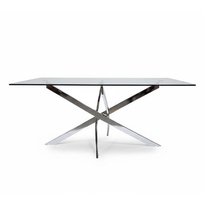 Front angled view of the VERDIS modern glass dining table showcasing the tempered glass top and mirror stainless-steel cross-frame base