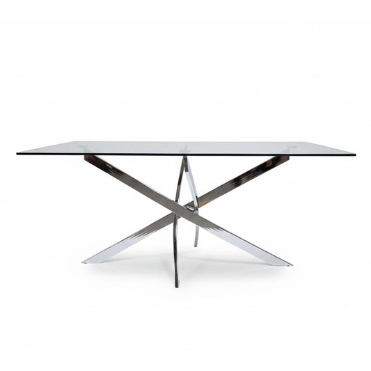 Front angled view of the VERDIS modern glass dining table showcasing the tempered glass top and mirror stainless-steel cross-frame base